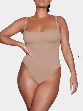 Skims NWOT Plus SIZE 2X/3X Tan “Fits Everybody” bodysuit tan color thong bottom.